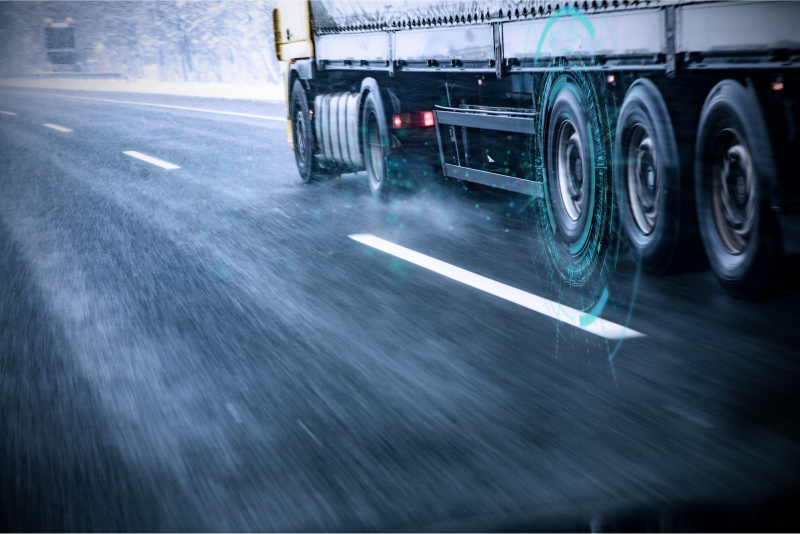Truck driving in the rain